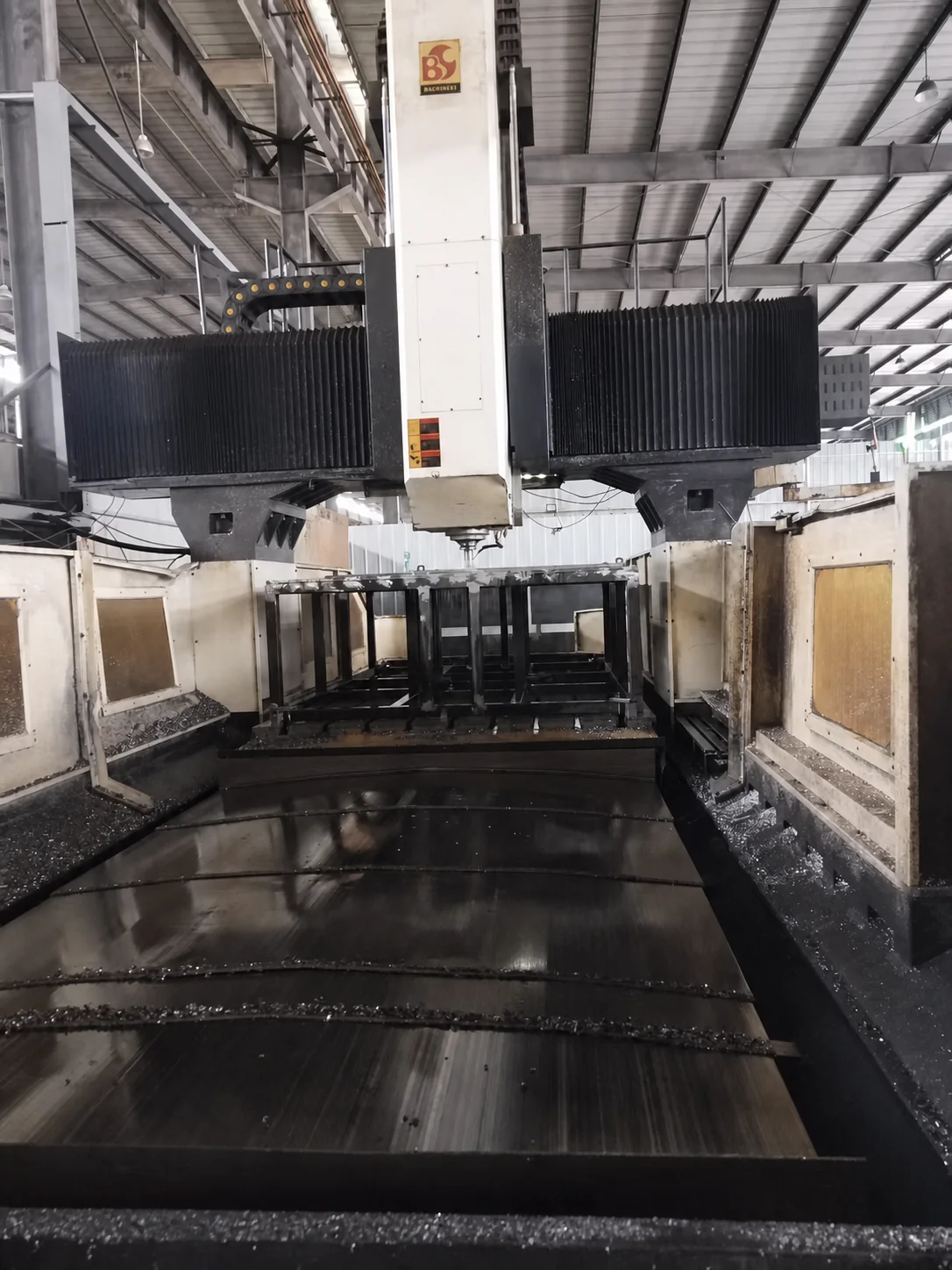 CNC machining stage for the welded base of an automatic bottle cap hot stamping machine